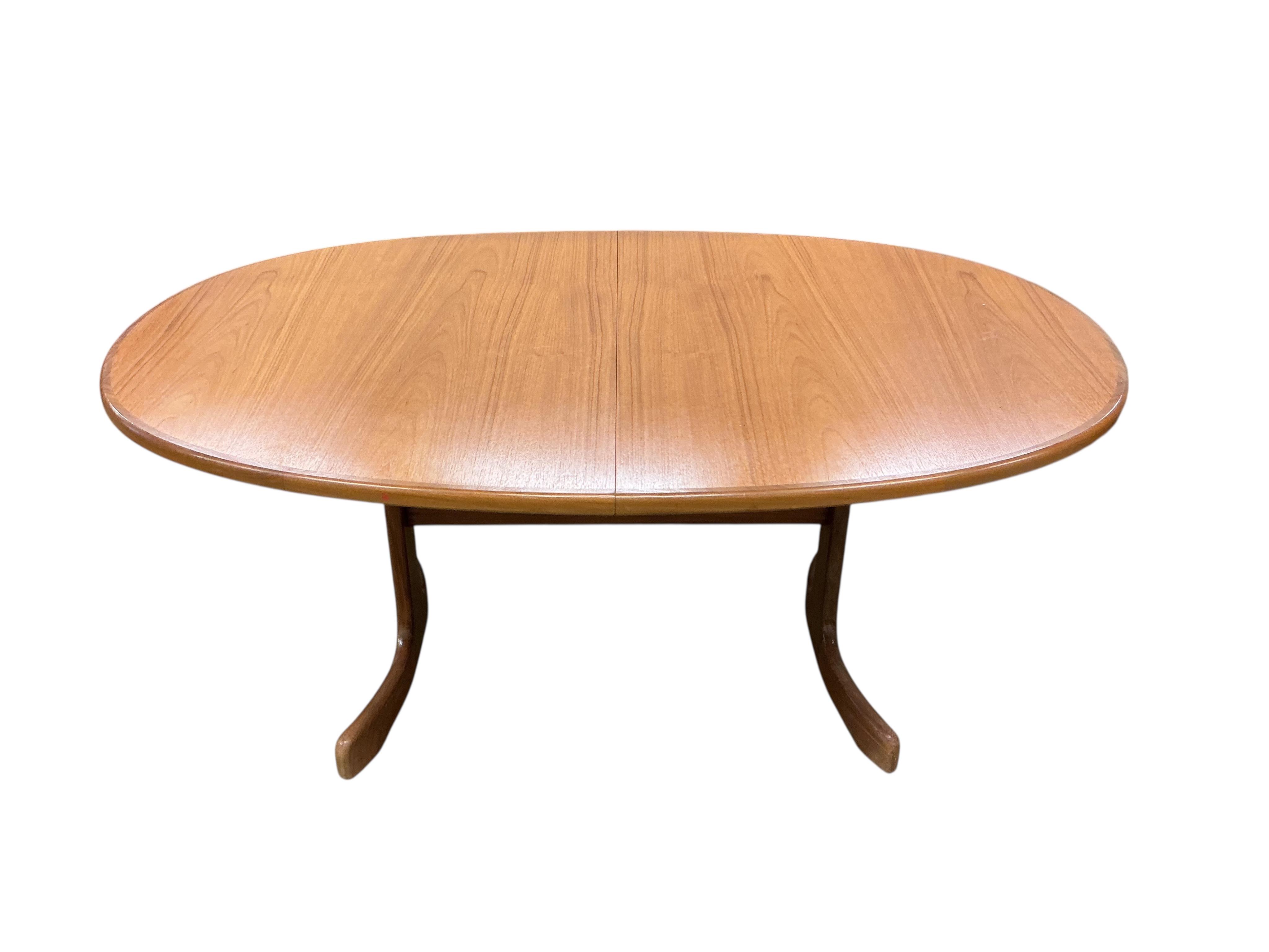 A mid century G plan teak extending dining table, width 162cm, depth 106cm, height 72cm together with a set of six chairs